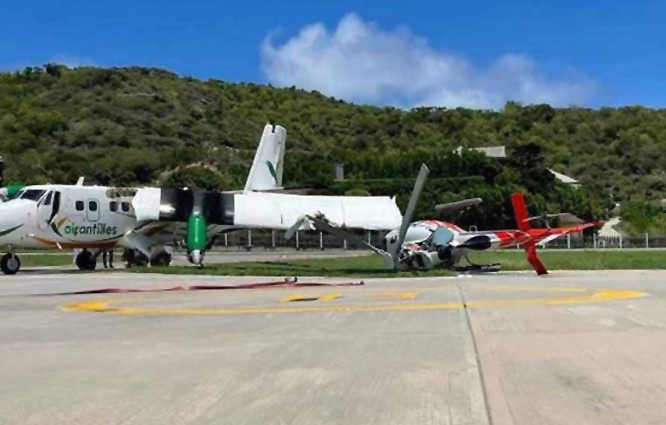 DHC-6 Twin Otter park halindeki helikoptere çarptı